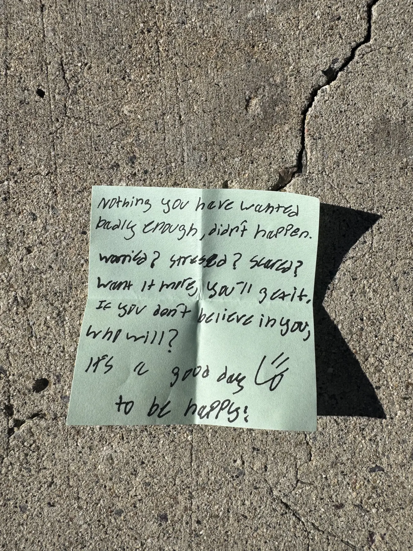 Handwritten sticky note with words of encouragement